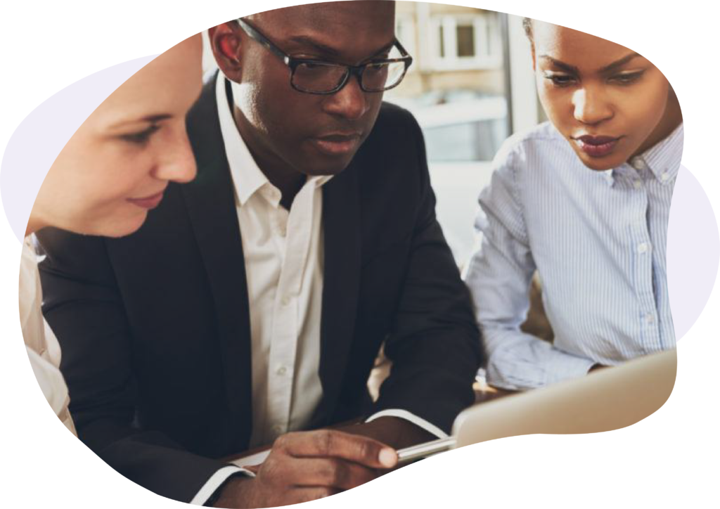 Three people looking at a laptop screen